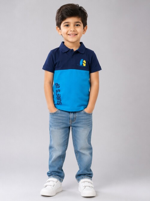 Boys blue polo shirt with surf print and navy blue collar design