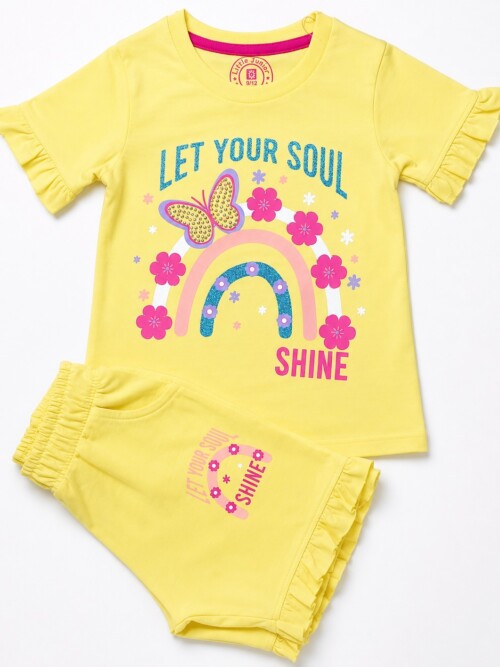 Toddler girl wearing yellow rainbow print t-shirt and matching shorts summer outfit