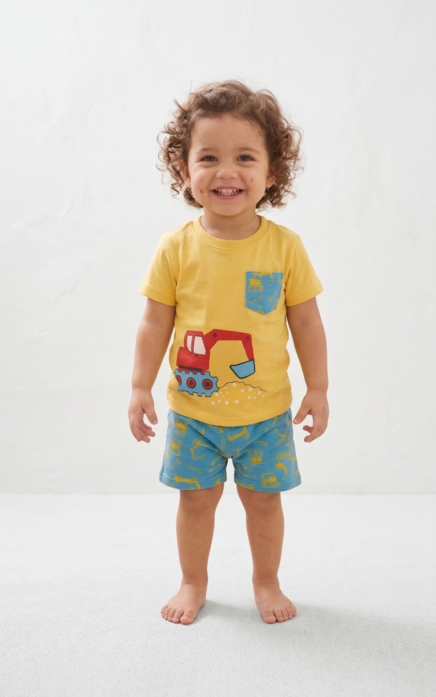 Baby boy wearing yellow excavator print cotton t-shirt with blue printed shorts summer outfit
